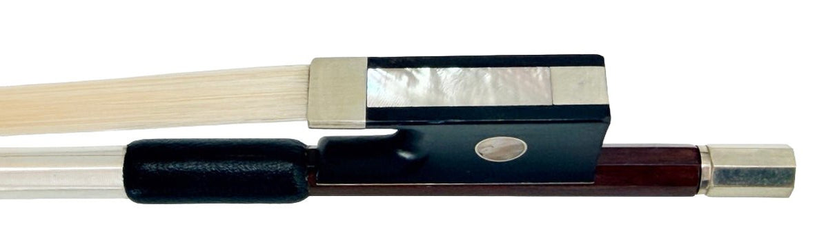 Close-up of the Artino Germany BF-315A Pernambuco Cello Bow – Octagonal, highlighting its frog crafted in the German tradition and showcasing horsehair, ebony and metal fittings, mother-of-pearl inlay, and an adjusting screw at the end.