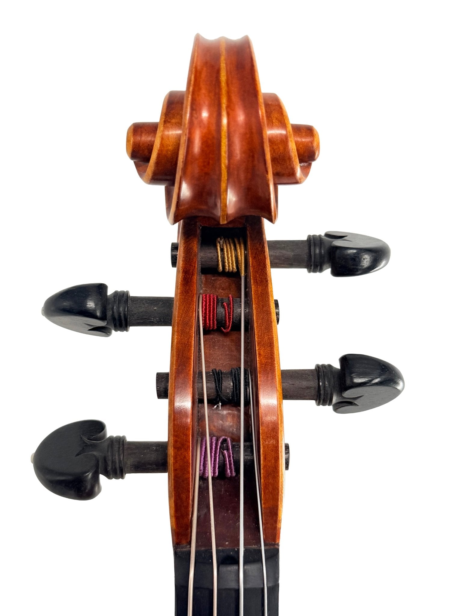 Close-up of the Canzona Maestro-Level Viola scroll and tuning pegs against a white background, highlighting flamed maple, bear claw spruce tonewoods, and multicolored strings wound around the pegs.