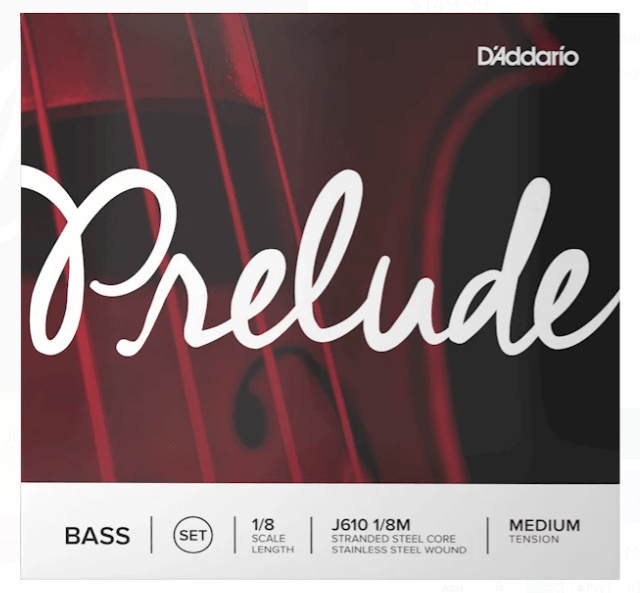 Close-up of D’Addario Prelude Double Bass String Set – Medium Tension packaging, featuring a bold red background, large white “Prelude” script, and a gray band below displaying details on size, material, and tension—ideal student bass strings with a durable steel core.