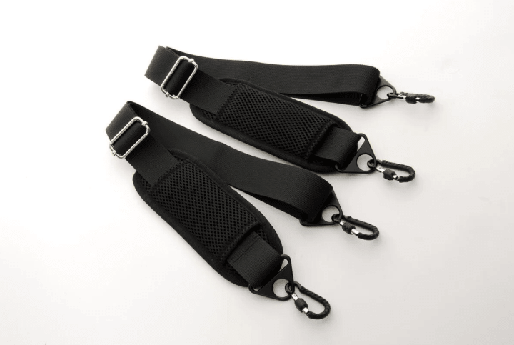 Two black adjustable shoulder straps with padded mesh sections and metal clips on both ends, designed for the Mirage CN513 Oblong Viola Case, placed on a white surface.