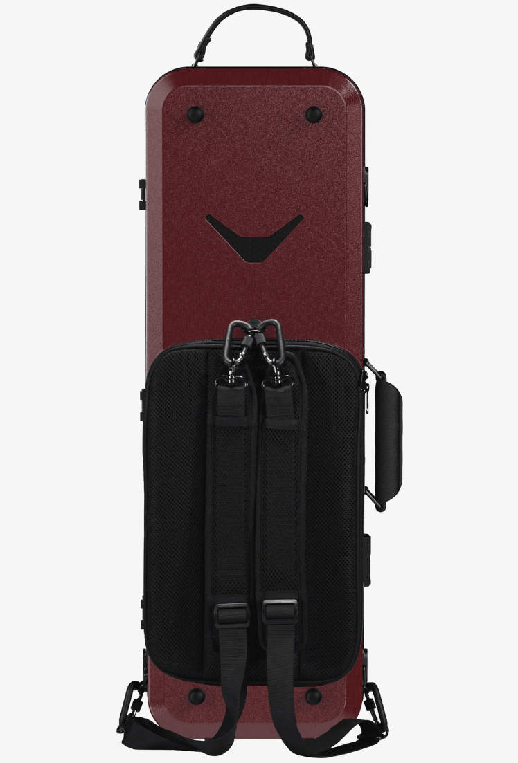 A dark red hard-shell instrument case with a black textured front pocket, dual shoulder straps, and a top carry handle, shown against a plain white background.