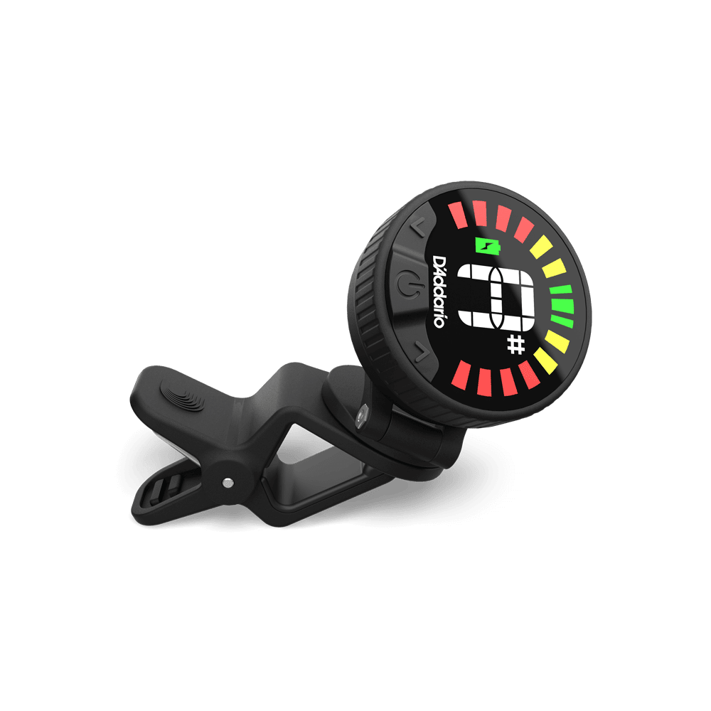 A Nexxus 360 USB Rechargeable Tuner, in black, features an omnidirectional LED round color display showing tuning info while clipped on with its spring-loaded clip, against a plain light background.