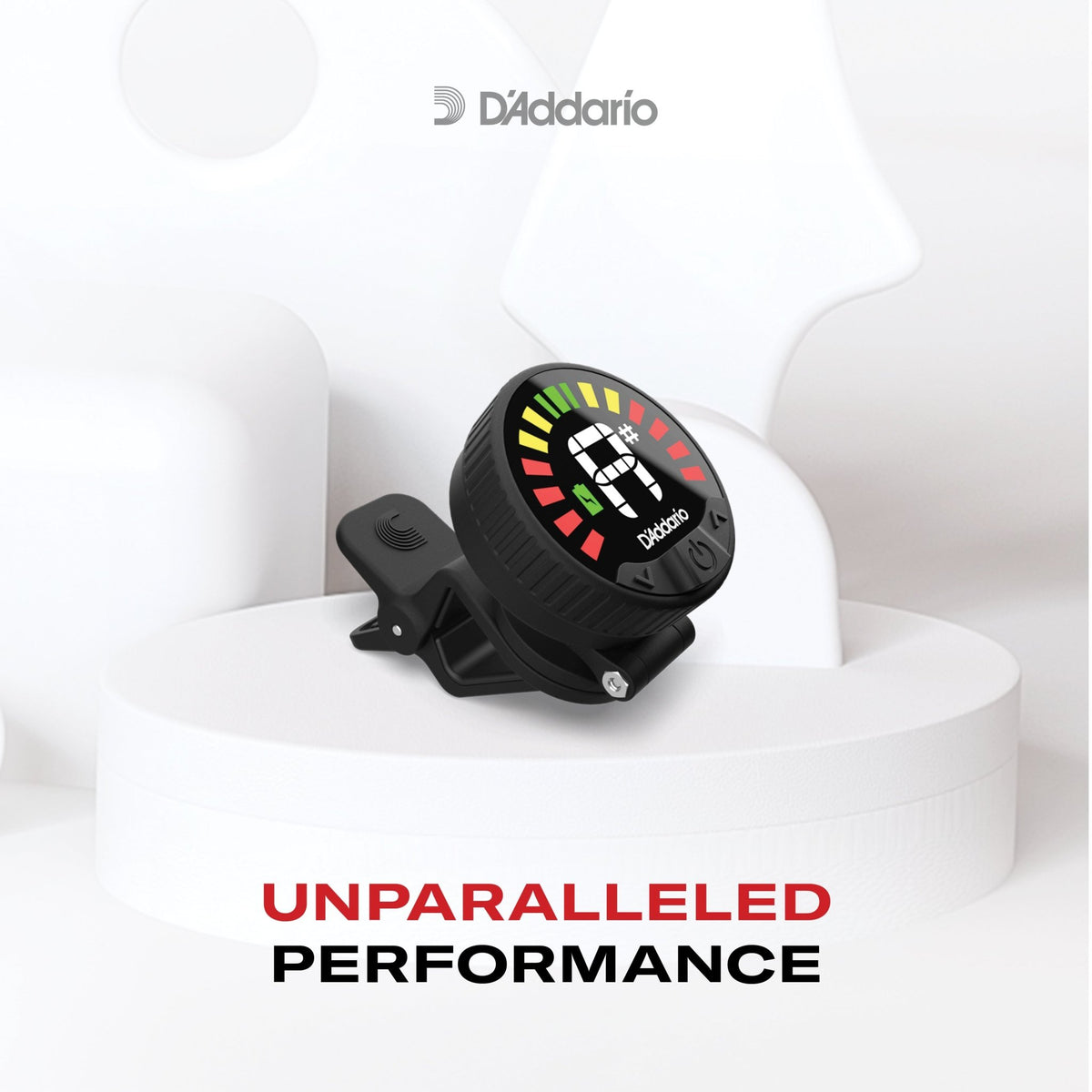 A Nexxus 360 Violin Rechargeable Tuner clipped to a white surface, displaying vibrant LED lights and surrounded by abstract white shapes. Text reads: UNPARALLELED PERFORMANCE.