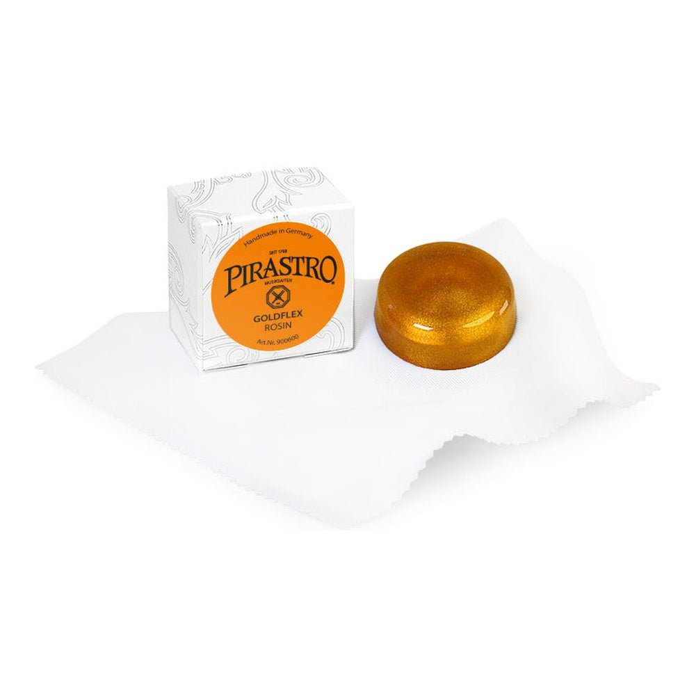 Pirastro Goldflex rosin box and gold-flecked rosin cake on cloth