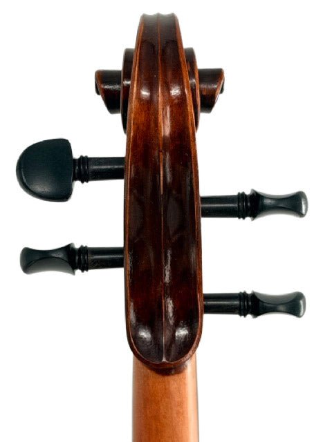 Close-up of a viola scroll and pegs, showcasing the polished wood craftsmanship and three visible tuning pegs—reminiscent of the top part of an Andreas Eastman VA305 Stradivari Viola, a popular choice among intermediate players inspired by classic Stradivari designs.