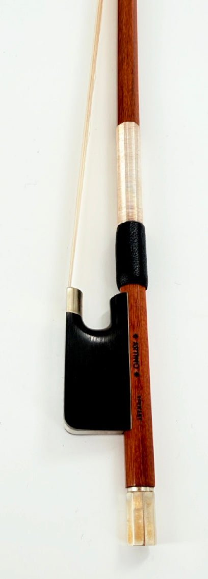 A close-up of the Artino Germany BF-215A Pernambuco Viola Bow – Octagonal, featuring a wooden shaft, silver winding, black leather grip, and a black frog with silver fittings, set against a white background.