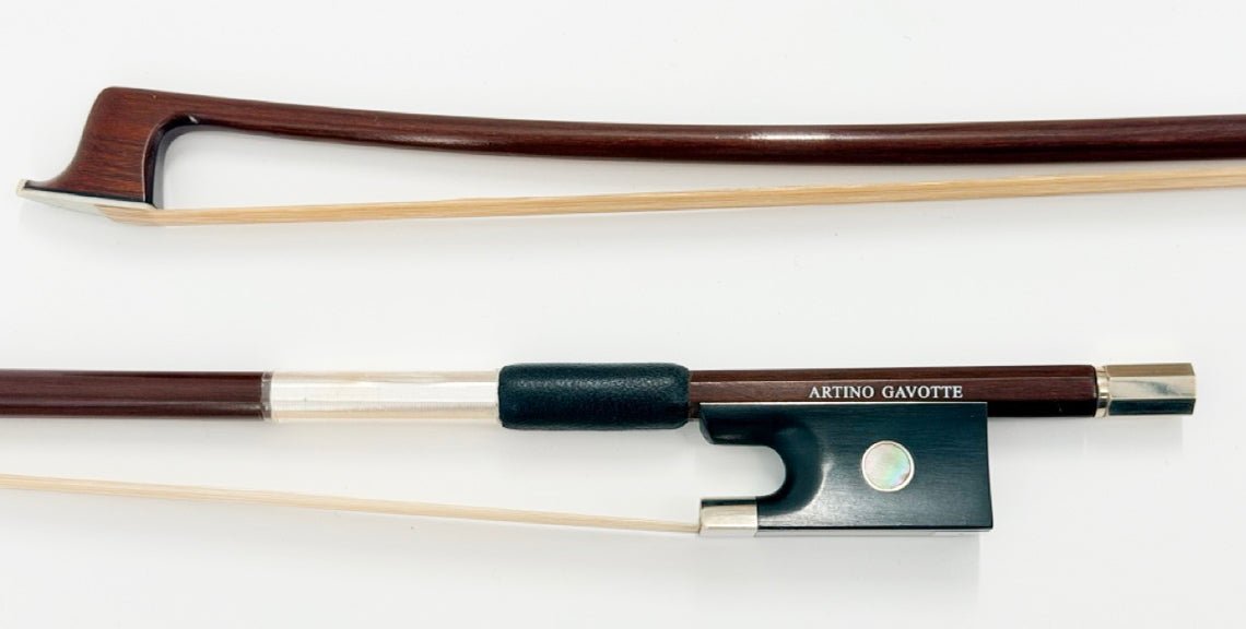 A close-up photo of an Artino Germany BF-315A Pernambuco Cello Bow – Octagonal showcases its wooden stick, frog, and horsehair against a white background, reflecting the tradition of German bow-making.