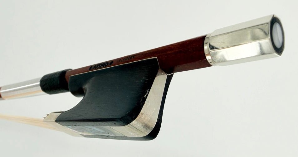 A close-up of the Artino Germany BF-315A Pernambuco Cello Bow – Octagonal, crafted in the tradition of German bow-making, showing the frog, stick, and metal fittings against a plain white background.