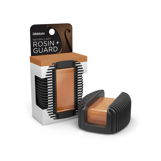 A rectangular block of natural light amber rosin is housed in a black, ribbed, shock-absorbent D’Addario Rosin Guard case. The packaging reads "D’Addario Rosin Guard with Natural Light Rosin" on a white background.