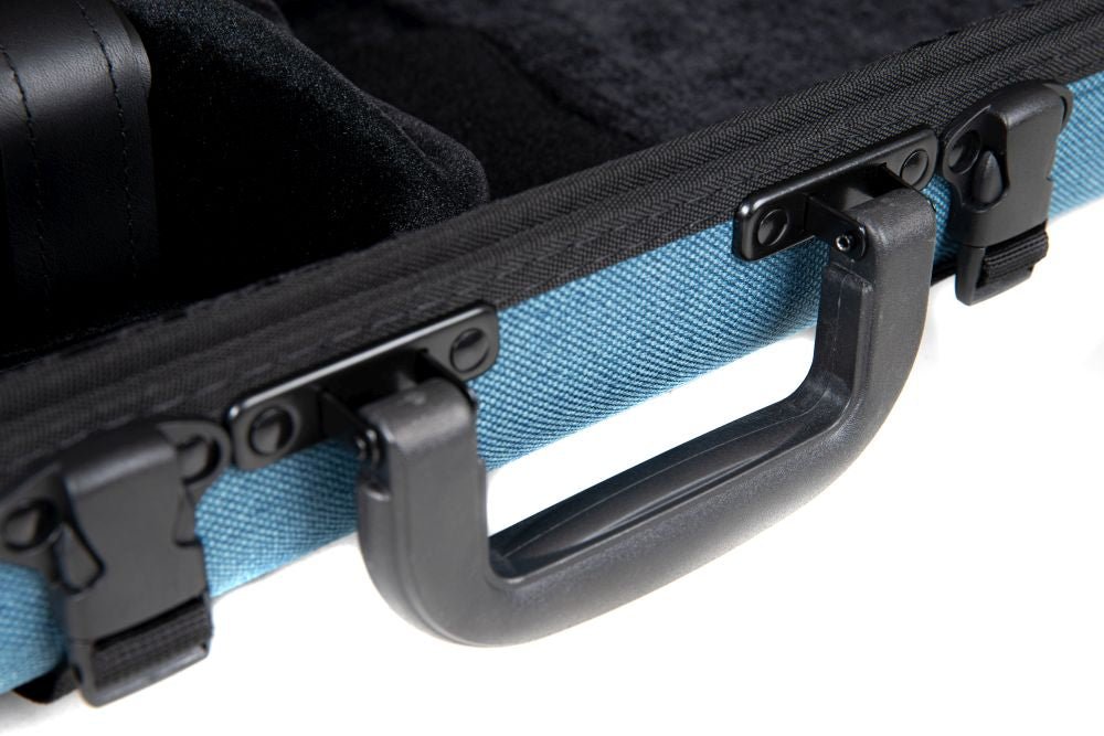 Close-up of the GEWA Bio-A Oblong Violin Case – Blue, featuring a sustainable design with a black plastic handle and secure clasps, shown partially open to reveal its soft, padded black interior. Adjustable to fit 1/2 to 4/4 violins.