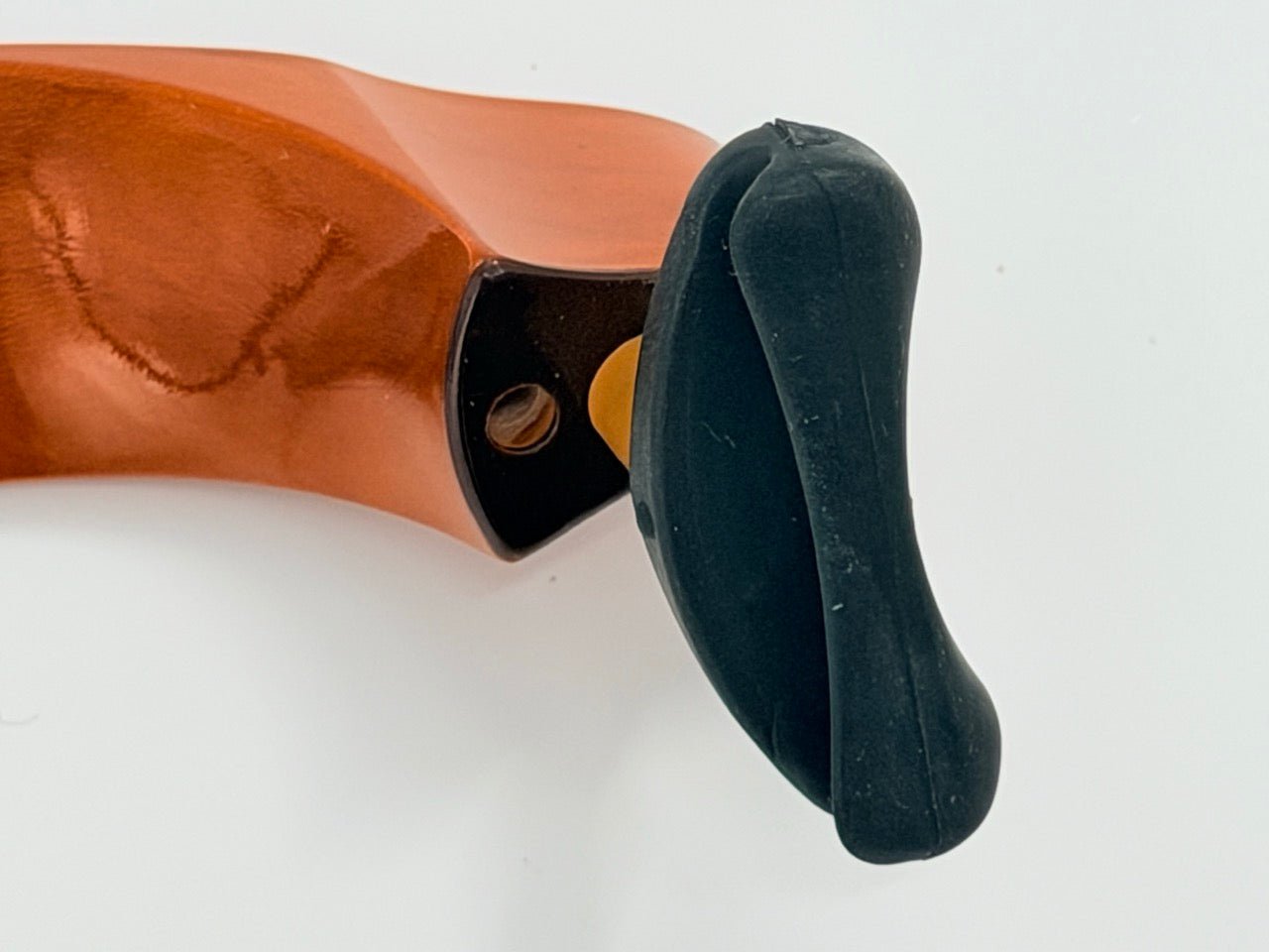 A close-up of the Mach One MA Maple Shoulder Rest – Premium Wooden Violin Support (4/4–3/4), featuring a curved, shiny copper-colored design with a black end cap, set against a plain white background.