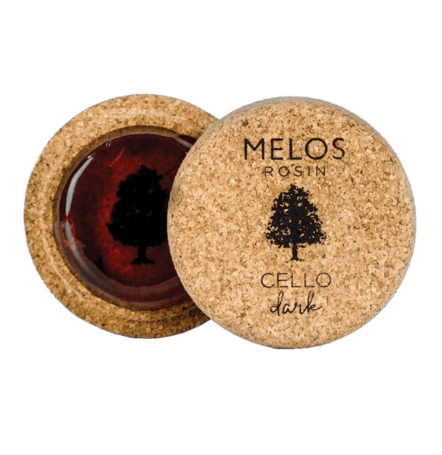 A round Melos Cello Rosin (Dark) for cello, labeled “Cello Dark,” features a cork lid and base, plus a dark tree logo on both the lid and the rosin.