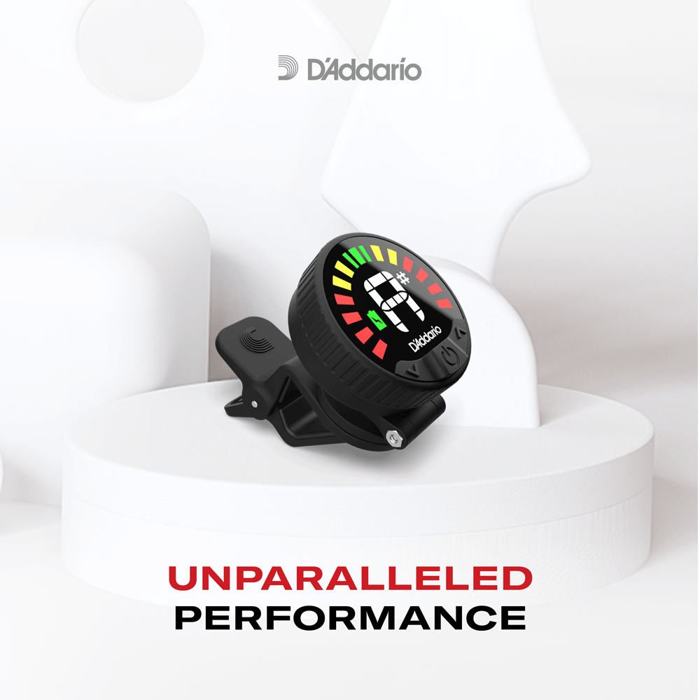 A Nexxus 360 Cello & Bass Rechargeable Tuner with a colorful LED display is clipped onto a white abstract prop. The text below reads, UNPARALLELED PERFORMANCE.