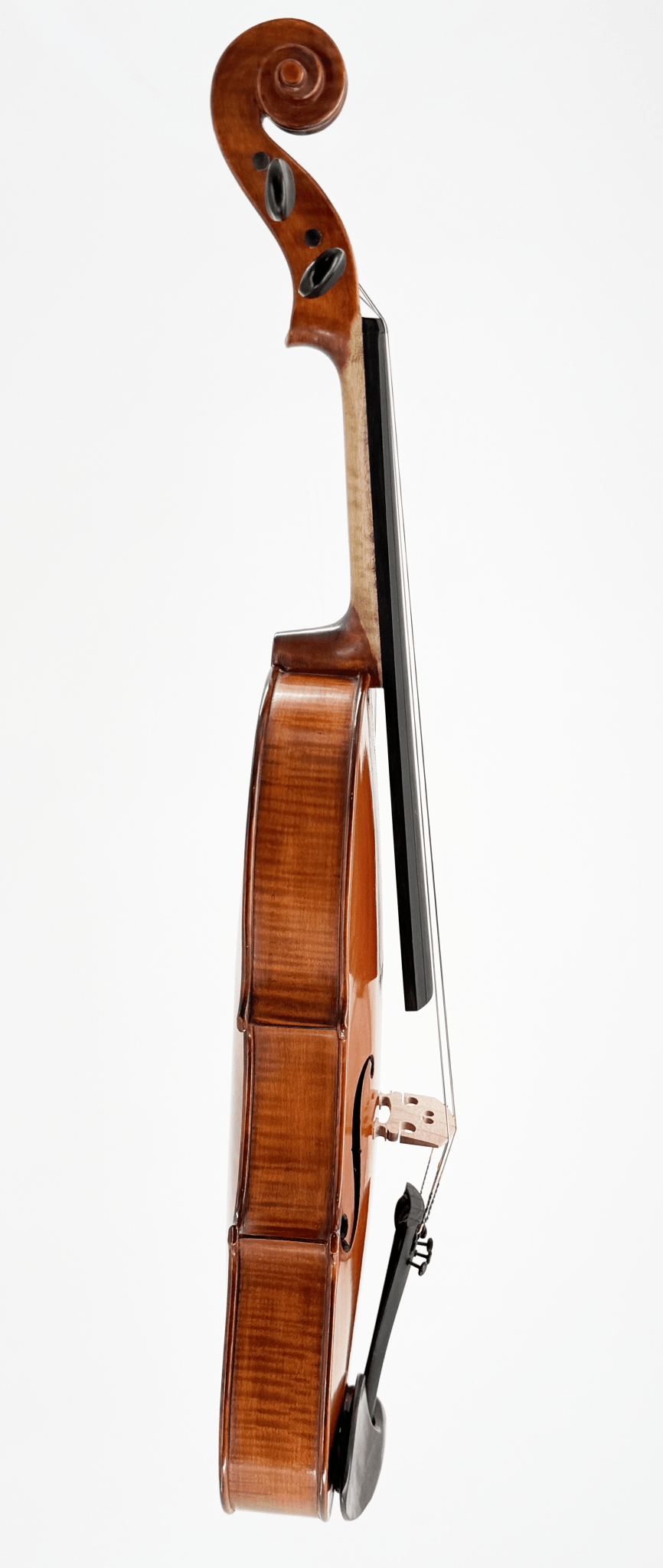 A side view of the Octav Mures Viola, expertly crafted from Carpathian tonewoods, stands upright against a white background, highlighting its strings, fingerboard, scroll, and the refined grain of its polished wooden body.