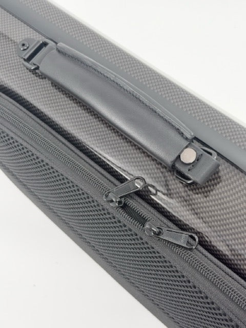 Close-up of the Otto Musica Mirage CN-512 Oblong Violin Case handle and zipper pulls, highlighting the black, lightweight design with textured material and a silver metal snap on the handle.