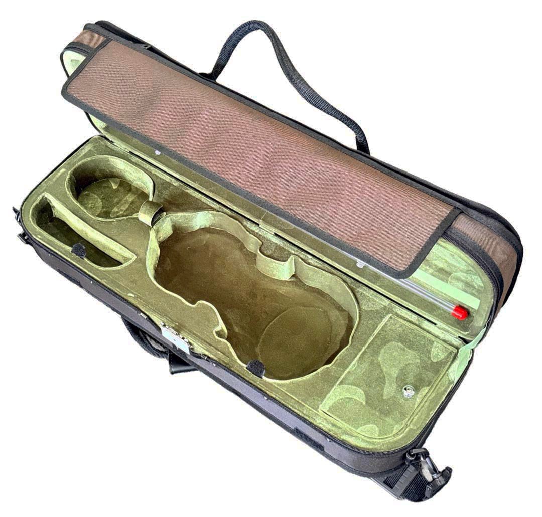 An open instrument case with a brown padded exterior and a green camouflage-lined interior featuring custom-cutout compartments, shown on a plain white background.